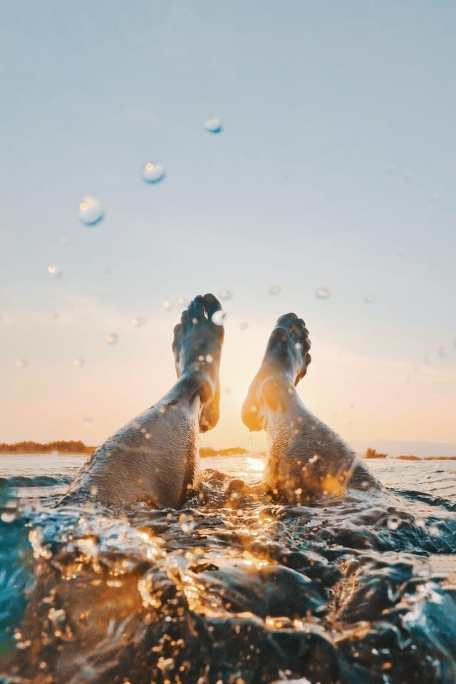 man swimming in the ocean 