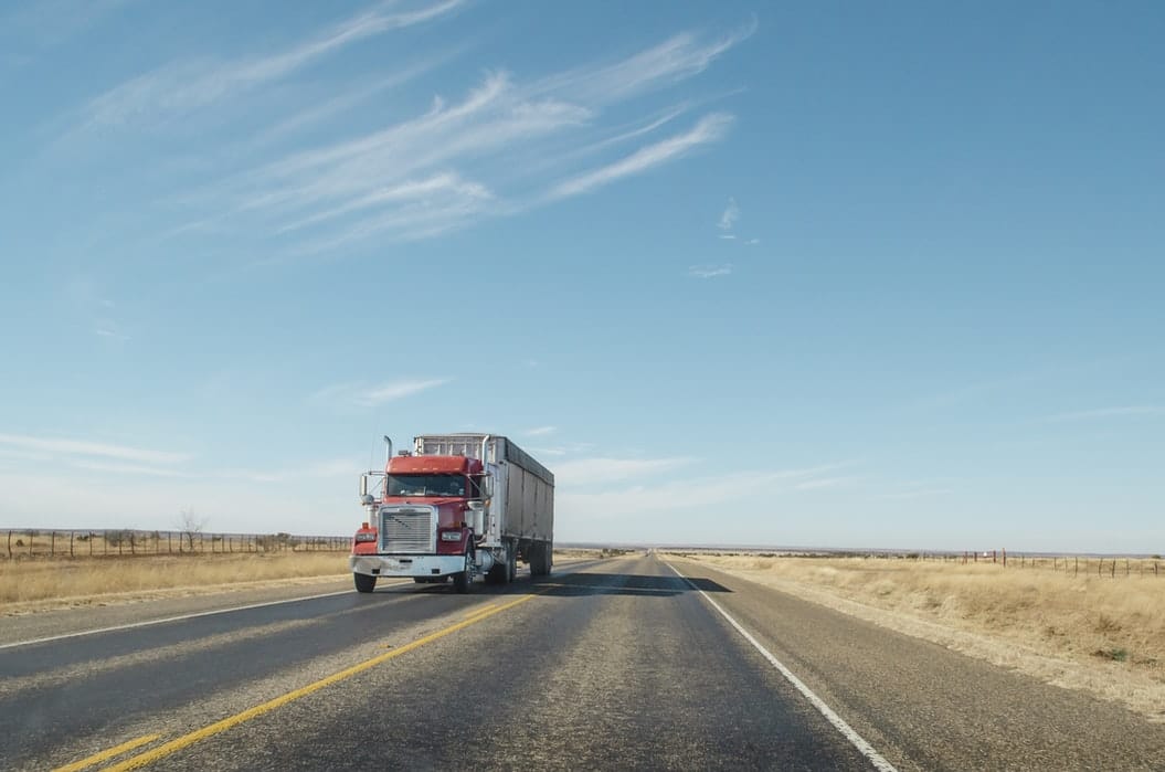 A truck drives along the road.