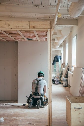 Construction worker inside of a building.