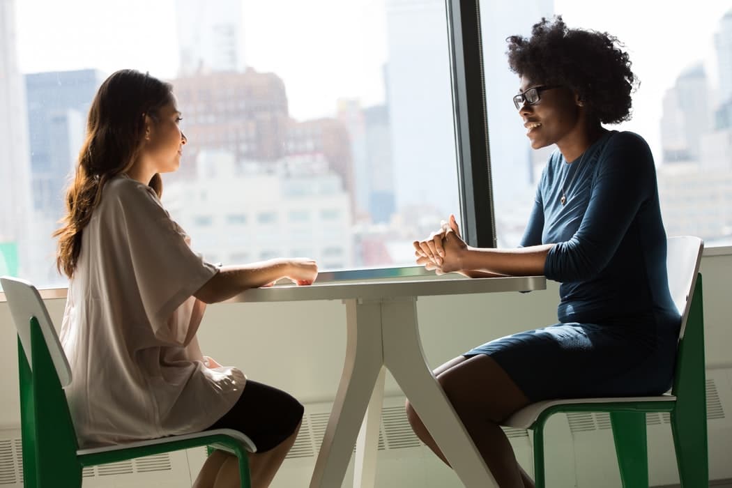 Two women having a conversation.