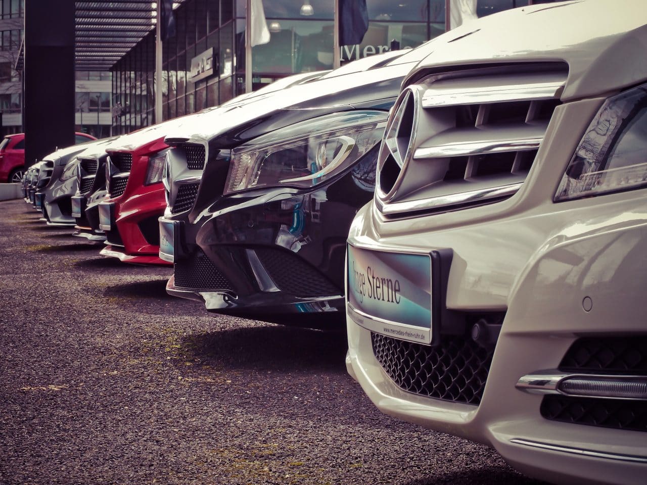 A row of cars parked in a lot.