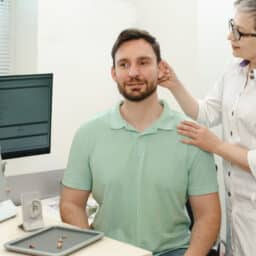 Man in a hearing aid fitting appointment