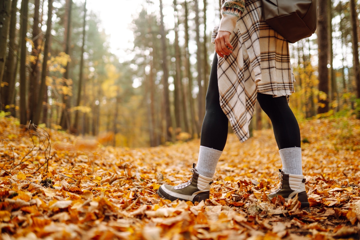 Woman takes hike in autumn