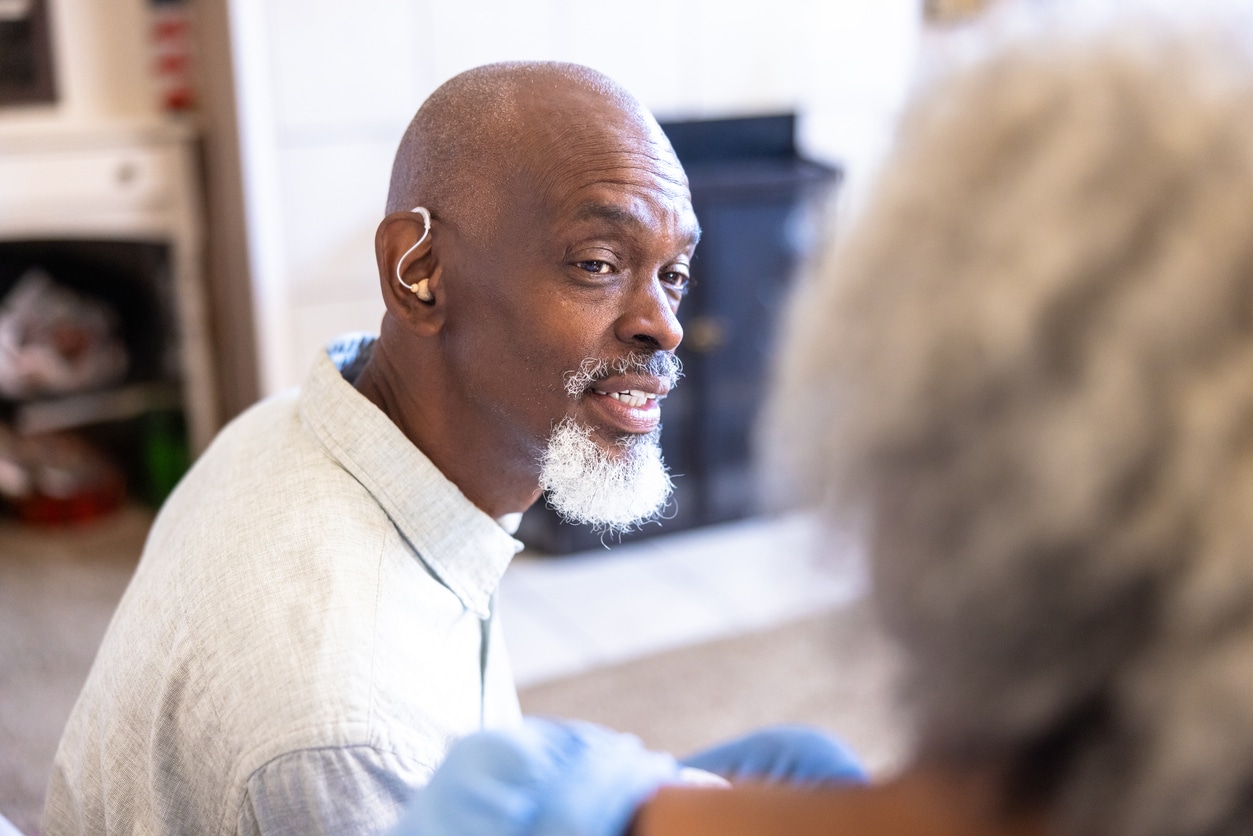 Senior man with a hearing aid.